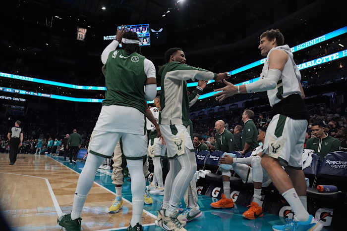 Milwaukee Bucks guard Malik Beasley (5) and center Brook Lopez (11) celebrate the win over the Charlotte Hornets